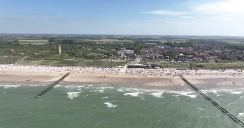 Aerial top down view on a summer beach in the Netherlands. Leisure sun bathing 스톡 동영상 303744077
