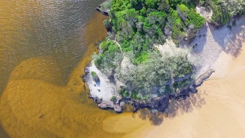 Aerial top-down view of Sunshine Coast riverbank meeting sandy beach and bu.. Stock-Footage 333441676