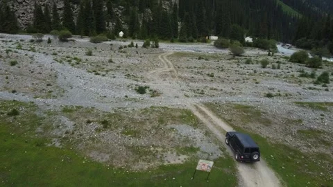 Aerial Top Down View of SUV Parked on S-Curve Mountain Road Stock Footage 332010385