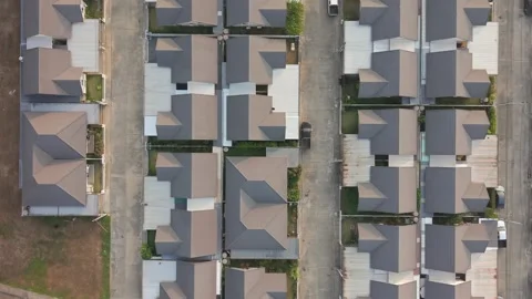 Aerial top down view of symmetrical modern house roofs in Thailand neighborhood Stock Footage 333719482