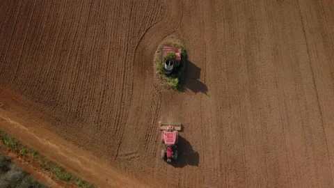 Aerial: Top Down View Of A Tractor Harrowing An Agriculture Field In Spring, Stock-Footage 163178791