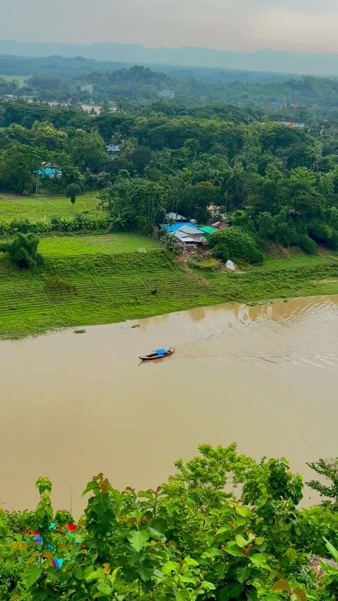 Aerial top-down view of traditional trawler navigating winding river. Видео 340529613