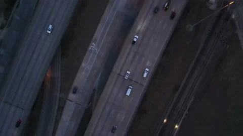 Aerial - Top Down View Of Traffic Crossing The Bridge Over Highway At Night Video stock 166521806