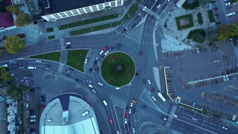 Aerial top down view of traffic roundabout in city evening 14 October Stock Footage 321311919