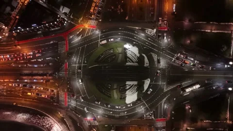 Aerial Top-Down View of Traffic Roundabout at Night - 4K Video Stock Footage 340044948