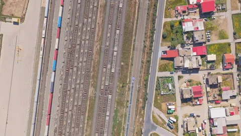 Aerial top-down view of a train traveling on a railway Stock Footage 333924744