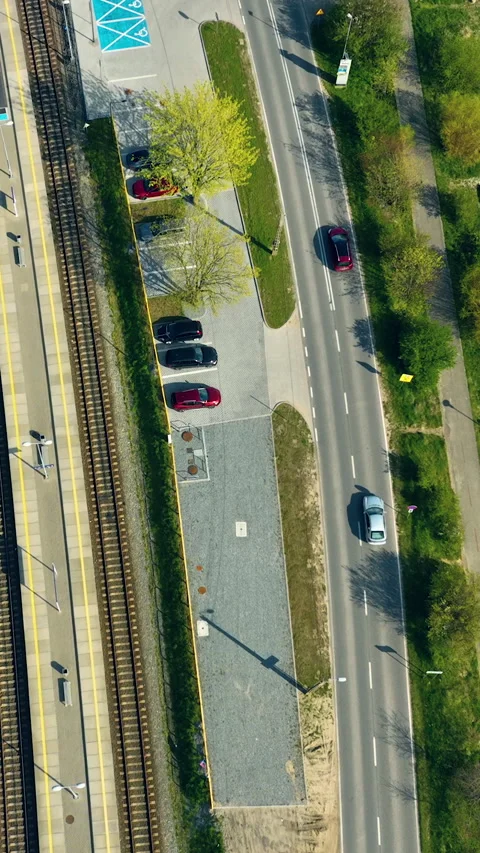Aerial Top Down View Of Train Station Platform And Road Traffic Stock Footage 342250265