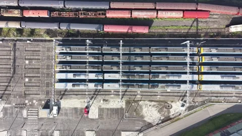 Aerial top down view of trains parked at a depot Stock Footage 339304598