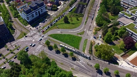 Aerial top down view of tram and traffic in Quartier de l'Etoile in Strasbourg Stock Footage 336339610