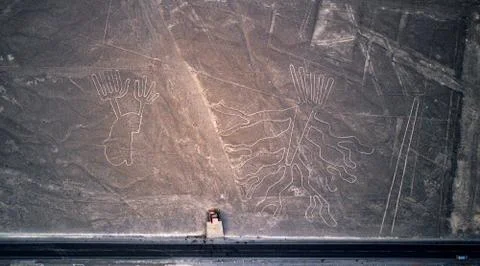 Aerial top-down view on "the Tree" and "the Lizard" one of the Nazca lines. Stock Photos
