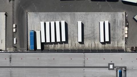 Aerial top down view of trucks at warehouse loading docks Stock Footage 342751794