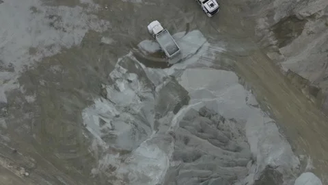 Aerial top-down view of trucks working in a sand quarry Видео 343846342