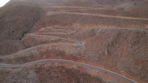 Aerial top down view of the turn. Winding road. Zig-zag road in Crete, Greece Video stock 168255579