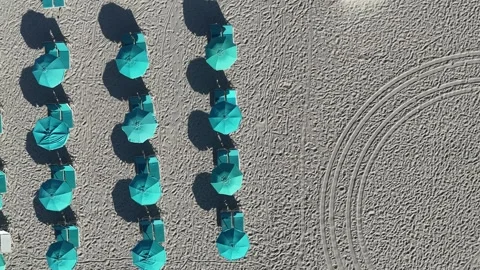 Aerial Top-Down View of Turquoise Beach Umbrellas in Neat Rows on Miami Sand Stock Footage 316582555