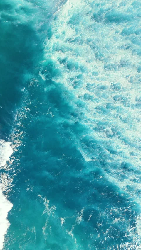 Aerial Top Down View of Turquoise Ocean Waves and Crashing Surf Video stock 329538054