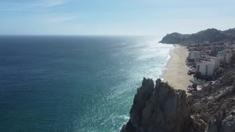 Aerial top-down view of turquoise sea waves crashing on granite rocks Stock Footage 330832752