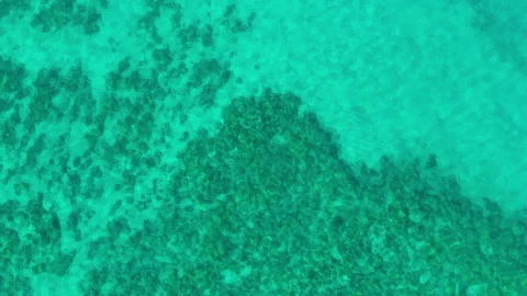 Aerial top down view of turquoise ocean water and coral reef on Big Island. Stock Footage 342572369