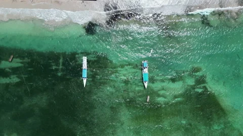 Aerial Top Down View of Two Fishing Boats On a Tropical Beach in Indonesia Stock Footage 209860613