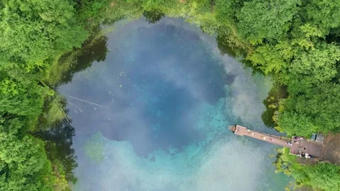 Aerial top down view of unique turquoise karst lake which has same temperature Stock-Footage 251727400