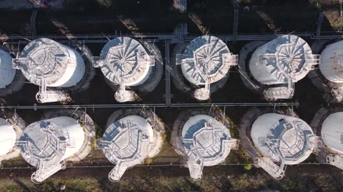 Aerial top down view of vertical white fuel storage tanks. Stock Footage 165402466
