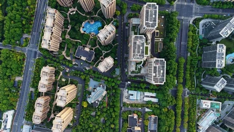 Aerial top down view of a vibrant residential district filled with modern Stock Footage 309792381