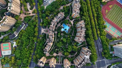 Aerial top down view of a vibrant residential district filled with modern 動画素材 311558102