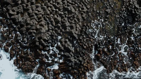Aerial top down view of volcanic basalt formation on the sea in West Iceland Stock Footage 118946278