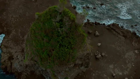 Aerial top down view of volcanic rock peak in Watulumbung beach Stock Footage 147129575
