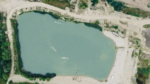 Aerial Top Down View of Wakeboarding and Water Sports on Quarry Lake Stock-Footage 337641723