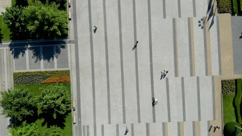 Aerial Top Down View  of Walking People with Long Shadows on the Square Stock Footage 222780305