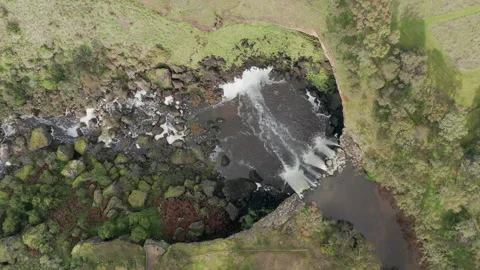 Aerial Top Down View of Wannon Falls Flowing Over Cliff On Cold Winter Morning Stock Footage 249639374