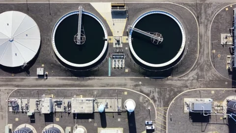Aerial top down view of a wastewater treatment plant Video stock 336875631