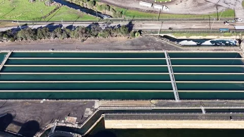 Aerial top down view of a water treatment plant facility Video stock 336875616
