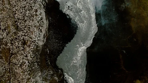 Aerial top down view of a waterfall on a river in a deep canyon in North Iceland Stock Footage 116548682