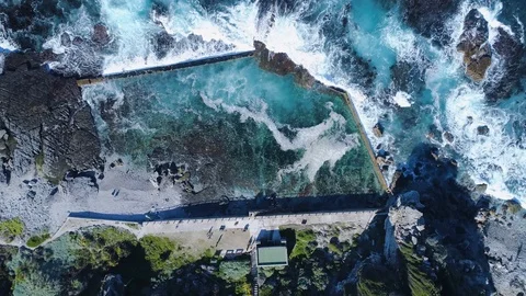 Aerial - Top down view of waves crashing into tide pool, drone shot Stock Footage 90835782
