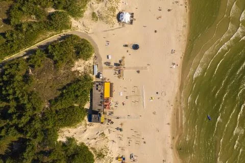 Aerial top down view of waves crushing on a sandy beach Stock Photos