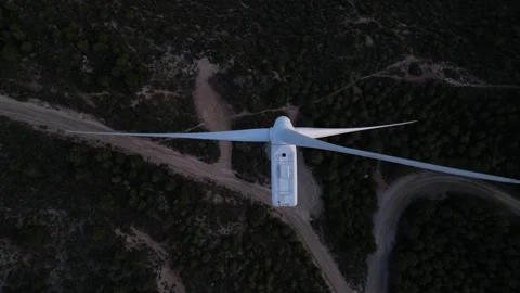 Aerial top down view of wind turbine blades rotating for renewable energy Stock Footage 327127851