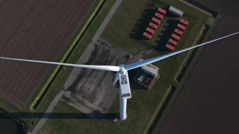 Aerial top down view of wind turbine generating renewable energy Vidéo 329595570
