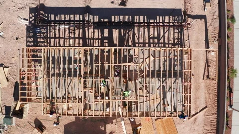 Aerial top down view of workers building new  residential wooden homes in Vegas Stock Footage 200519261