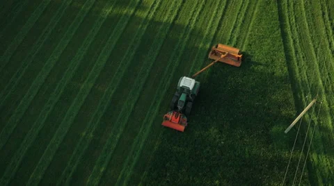 Aerial Top down View of Working Agricultural Harvester on Green Field. Stock Footage 64934635