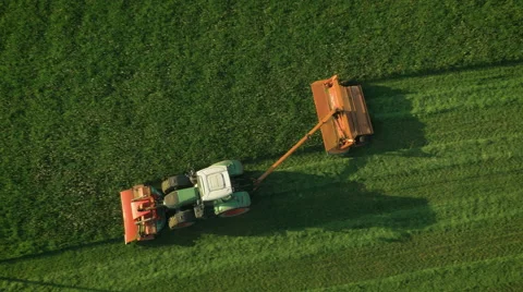 Aerial Top down View of Working Agricultural Harvester on Green Field. Stock Footage 64935483