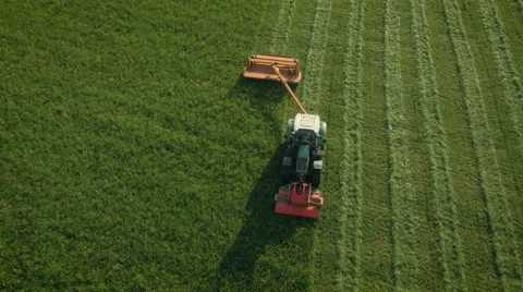 Aerial Top down View of Working Agricultural Harvester on Green Field. Stock Footage 64936011