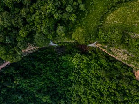 Aerial top down of waterfall in forest at Chapada dos Guimares National Par.. Stock Photos