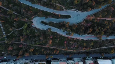 Aerial top down from of winding hiking trail Lycabettus Hill winter sunset .. Видео 313674052