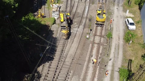 Aerial top down of workers on railway track construction, Passau Stock Footage 338243867