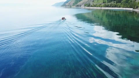 Aerial, top drone scene of catamaran anchored in a bay with transparent Video stock 123402553