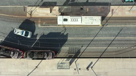 Aerial Top drone view over Bus and Electric Metro transports in Lisbon, Portu Stock Footage 169411029