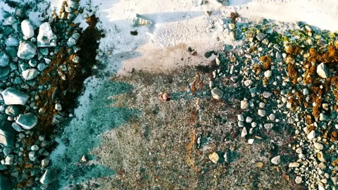 Aerial Top Forward Shot Of Blond Man Walking In Water At Beach, Drone Flying 스톡 동영상 233997561