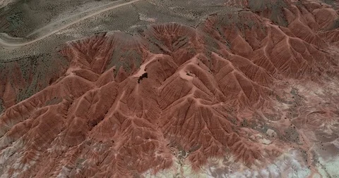 Aerial from top to front view of red eroded dry mountainous landscape 스톡 동영상 103498536
