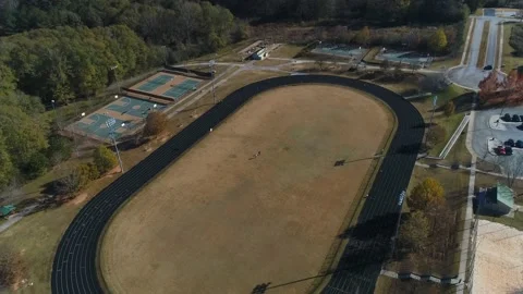 Aerial Top Half View Of Walking Track With Basketball Court Stock Footage 219030223